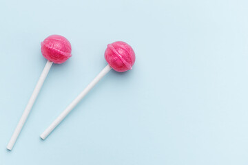 Sweet lollipops on blue background