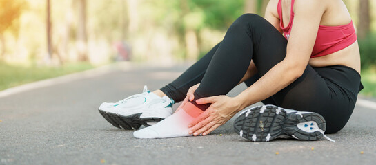 Young adult female with his muscle pain during running. runner woman having leg ache due to Ankle...