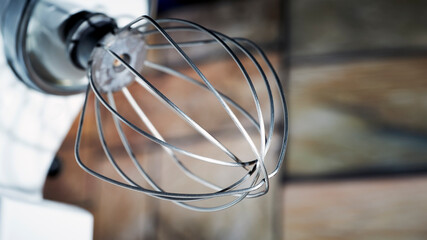 Fototapeta na wymiar wire whisk - an important part of the mechanism for whipping cream