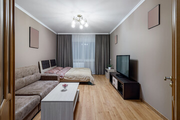 Gomtinaya in a small apartment with sofa, TV, large bed and coffee table