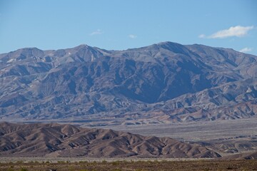 Heading out of Death Valley to the north, mountains rise above the California-Nevada border, part of the seemingly endless series of parallel mountain ranges making up the  Basin and Range region.