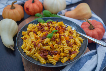 pumpkin pasta with fresh herbs and crispy bacon