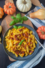 pumpkin pasta with fresh herbs and crispy bacon