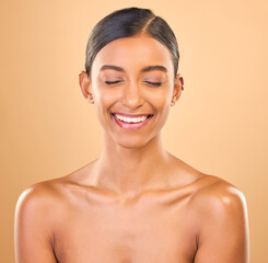 Beauty, face and smile of woman in studio for skincare, cosmetics, dermatology or makeup. Aesthetic female .laughing for self care, natural skin and spa facial shine results on a brown background