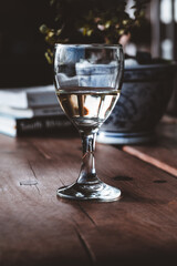 Glass of White Wine on Wooden Coffee Table