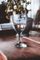 Glass of White Wine on Wooden Coffee Table