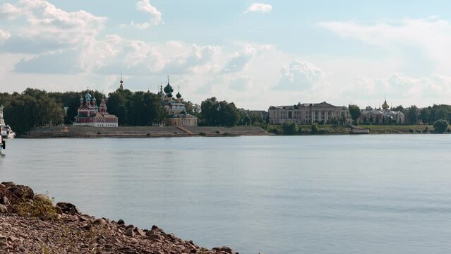 View of Uglich townscape on banks of Volga river with Kremlin Cathedrals summer day. Russia. Time-lapse.
