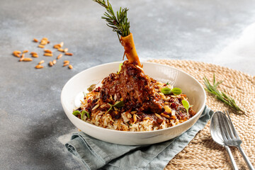 Lamb Shank biryani rice served in dish isolated on table top view of arabic breakfast