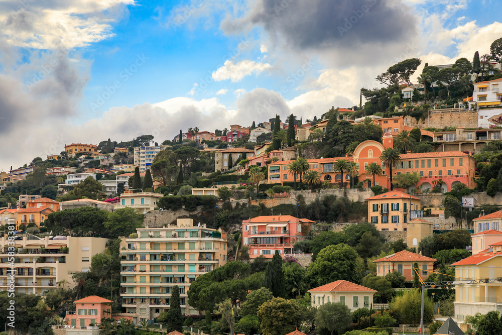 Wall mural Luxury homes on a mountain side in Villefranche sur Mer in the South of France