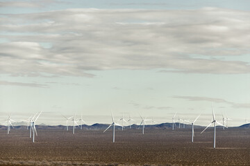 Windmill turbines scattered n the Tehachapi Pass of the Mojave Desert in Southeast California