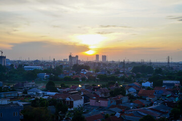 Majestic sunrise over the city with urban skyline in the background