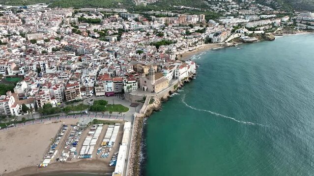 Sitges church aerial view. Drone footage of mediterranean coast, Costes del Garraf. Esgl&eacute;sia de Sant Bartomeu.