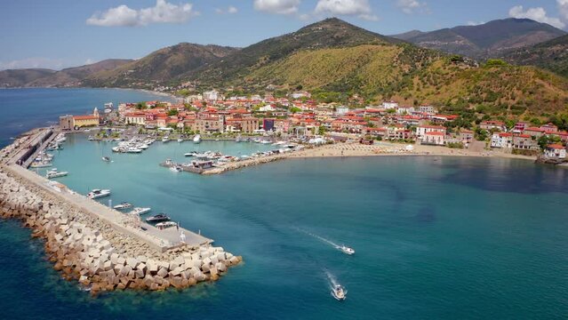 4k drone forward video (Ultra High Definition) of Acciaroli port. Wonderful outdoor scene of Mediterranean coast of Italy. Traveling concept background.