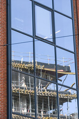 Bruxelles Belgique batiment logement immobilier building maison renovation chantier grue travaux reflet verre