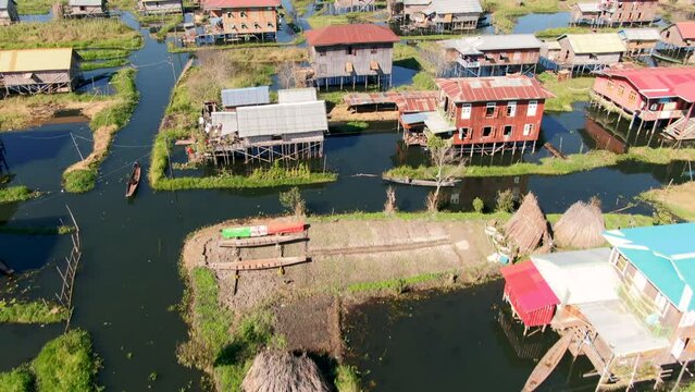 Drone lifting shot over Eain Taung Gyi village at Inle Lake in Myanmar.