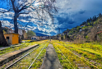 Springtime  at the train station of Edessa town (Pella, Macedonia, Greece). - obrazy, fototapety, plakaty