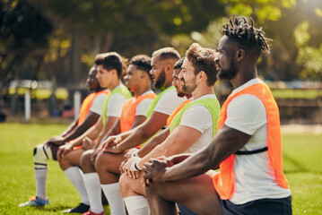 Rugby sport, diversity and men training outdoor on a grass field with a team on knee. Athlete group together for fitness, exercise and workout for professional sports club and strong teamwork