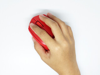 Hand holding red wireless mouse isolated on white background