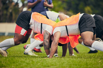 Fototapeta premium Rugby, scrum and team of men training on grass field ready for match, practice and sports game. Fitness, performance and male athletes in tackle for warm up, exercise and workout for competition