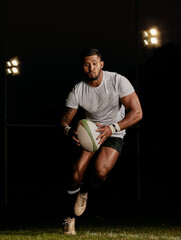 Rugby, night and man running with ball to score goal at dark stadium at game, match or practice...