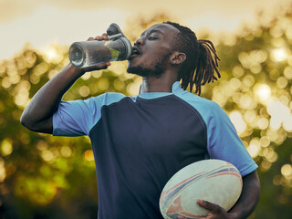 Drinking water, fitness and rugby with a sports black man outdoor for a competitive game or event....