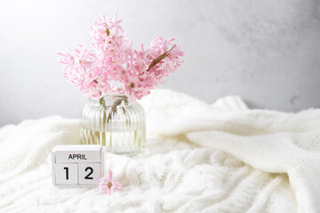 Pink hyacinth in vase and calendar date April 12. Included in the group of horizontal and vertical photos with all April dates