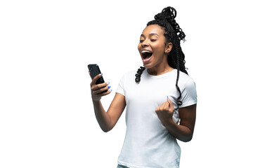 Positive curly haired ethnic woman uses mobile phone checks messages and reads news holds modern cellular in hands looks with curious happy expression isolated over transparent background