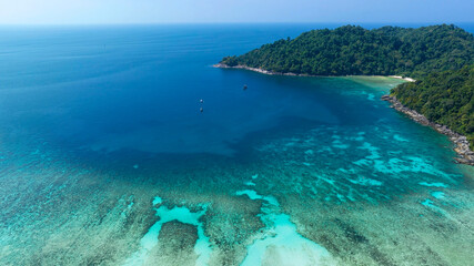 Aerial view with The tropical seashore island in a coral reef ,blue and turquoise sea Amazing nature landscape with blue lagoon