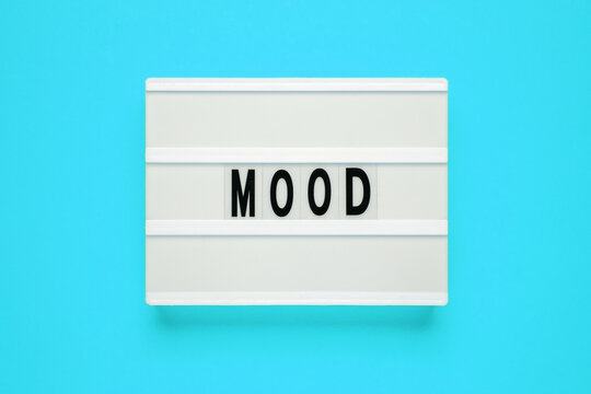 Lightbox with word mood on blue background.