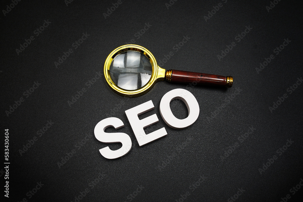 Poster seo (search engine optimization) text message with magnifying glass on black background