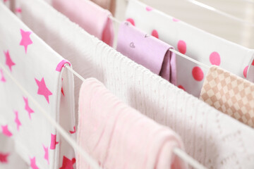 Different apparel drying on clothes airer, closeup