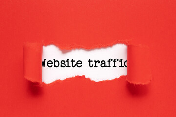 Memo note written with text WEBSITE TRAFFIC on red background.