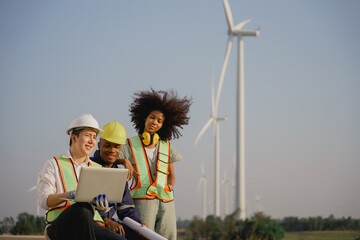 Group of Young Electrical Maintenance Worker at Wind Turbine Farm. Engineering at Wind Turbine...