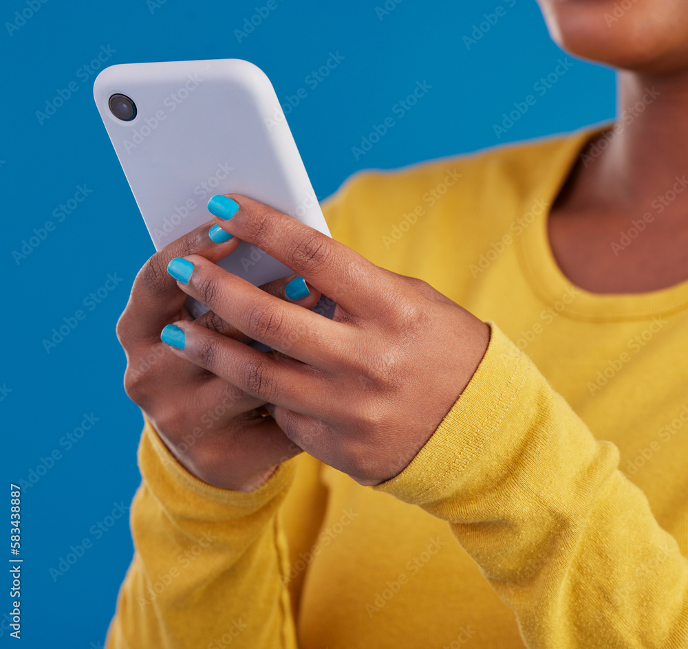 Poster phone, typing and closeup of hands of woman in studio for social media, text message and browse webs