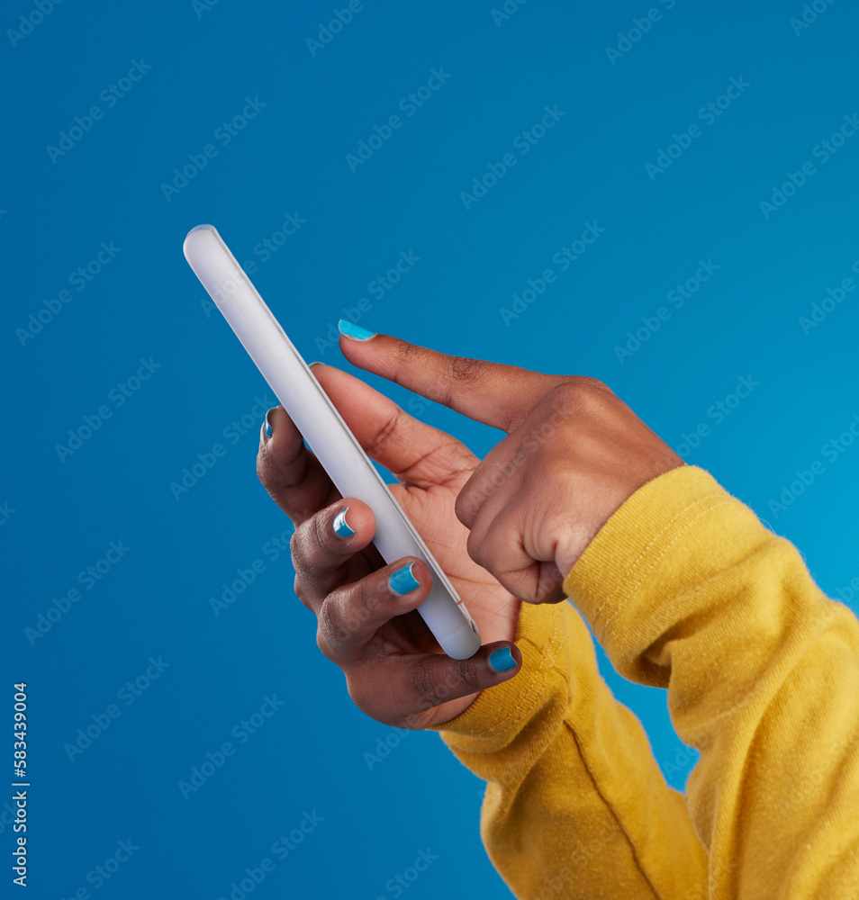 Aufkleber Phone, typing and hands of woman point to screen in studio for social media, text message and website. Communication, technology and girl on internet, networking and chat online on blue background