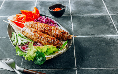 Kebab plate with vegetable and pita. Traditional middle eastern, arabic or mediterranean cuisine. Healthy foood