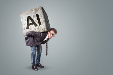 Businessman struggling under an AI-labeled stone on his back