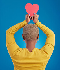 Paper, heart and back of black woman in studio for love, date and kindness. Invitation, romance and...