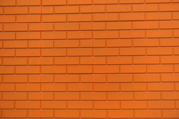 Texture of bright orange brick veneer wall