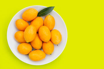 Marian plum fruit isolated on green background