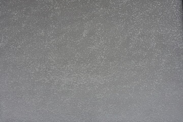 Backdrop - gray semi-smooth wall with stucco lace finish - obrazy, fototapety, plakaty