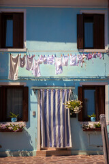 Burano, Venice Lagoon, Italy: a little cottage with the ubiquitous washing hanging out to dry on Fondamenta Pontinello Sinistra, 