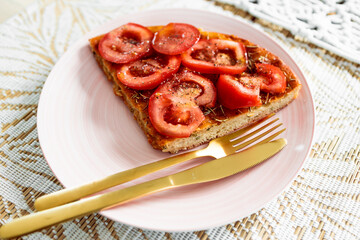 vegan homemade focaccia topped with fresh tomato
