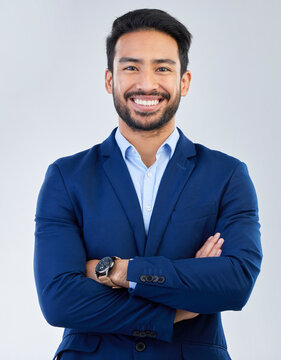 Business Man, Smile And Arms Crossed Portrait In Studio For Corporate Or CEO Fashion While Happy. Face Of Asian Entrepreneur Person Isolated White Background With Pride For Luxury, Success And Wealth