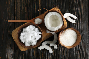 Composition with coconut on wooden background, top view
