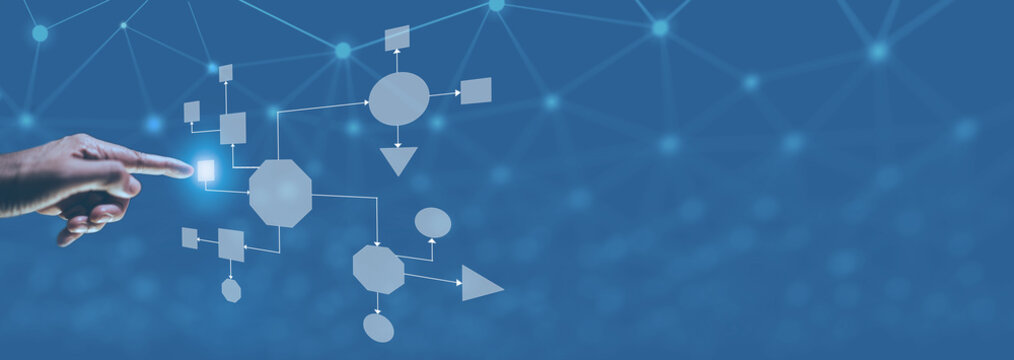 Business process and workflow automation with flowchart, businessman in background	