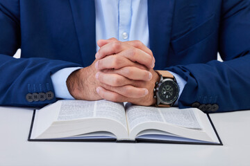 Closeup, hands and man with bible, praying and guidance with higher power, hope and spiritual....