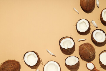 Composition for summer concept with coconut on beige background