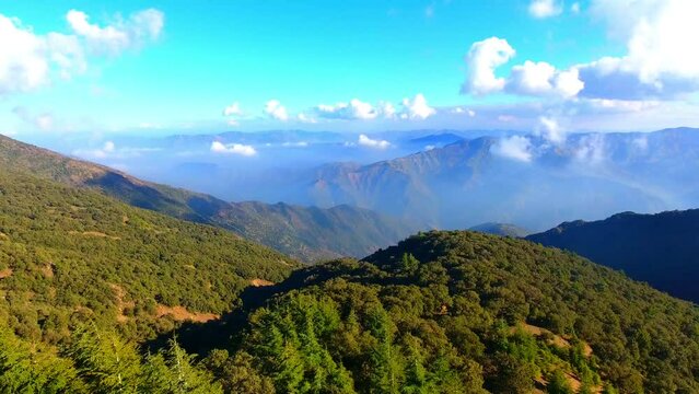 aerial shot with drone of the mountains of the chrea national park in Algeria under a blue sky with some clouds