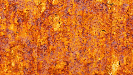 Rusty iron door surface closeup, old rusted orange metal background.